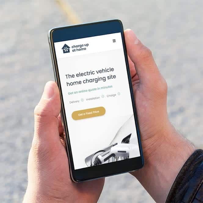 Charge Up at Home website on a smartphone held in a hand