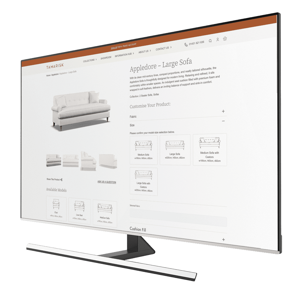 Monitor showing an ecommerce product page for a large sofa