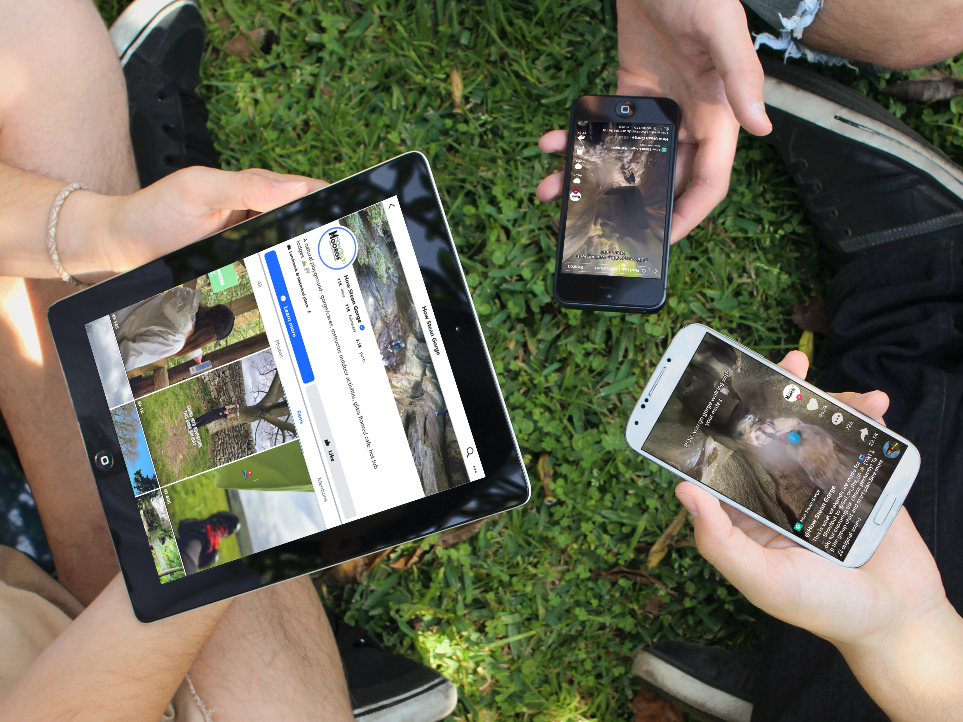 How Stean Gorge social posts on a tablet and two phones, held over grass